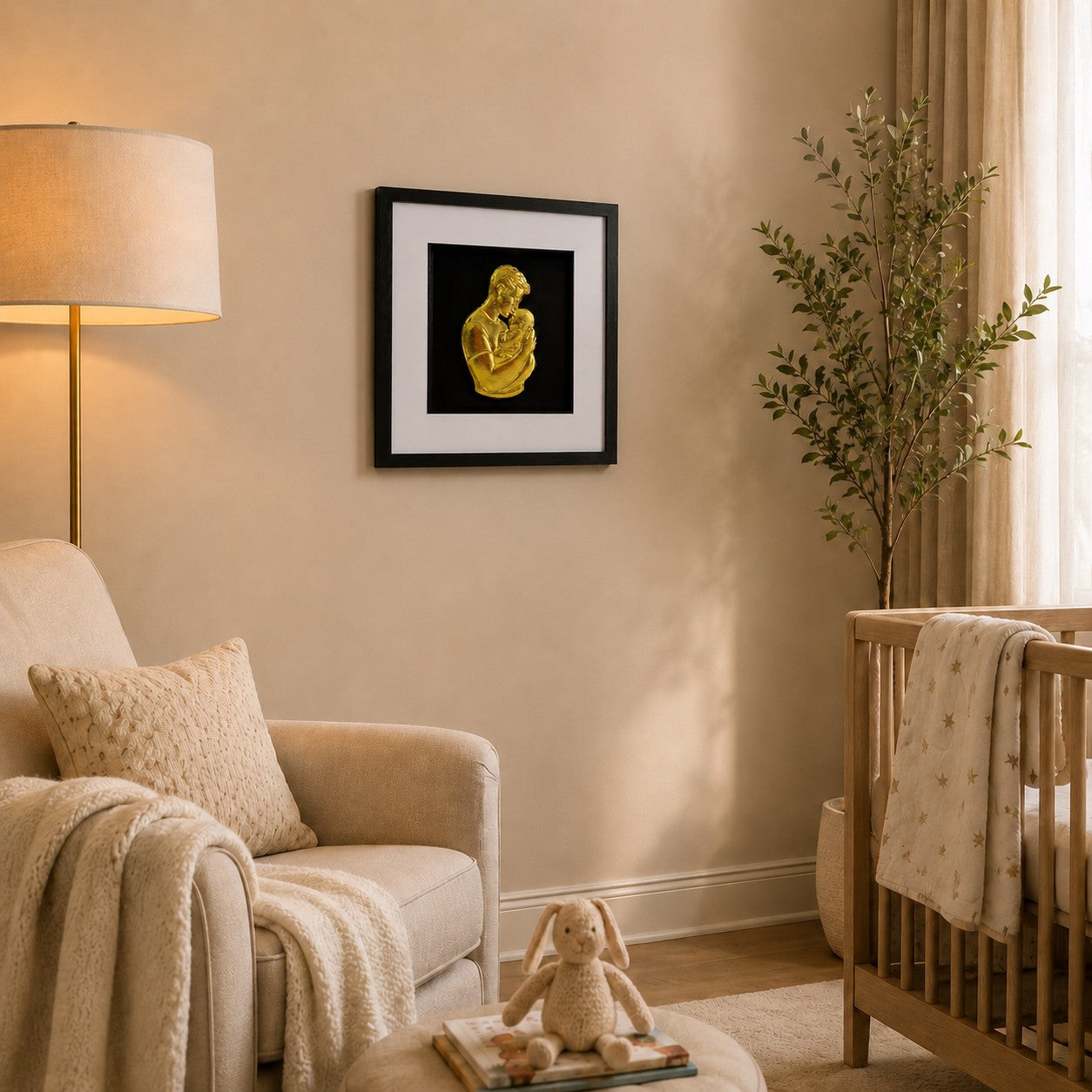Gold father and baby framed artwork in a calm nursery with cot, armchair, lamp and soft textiles.