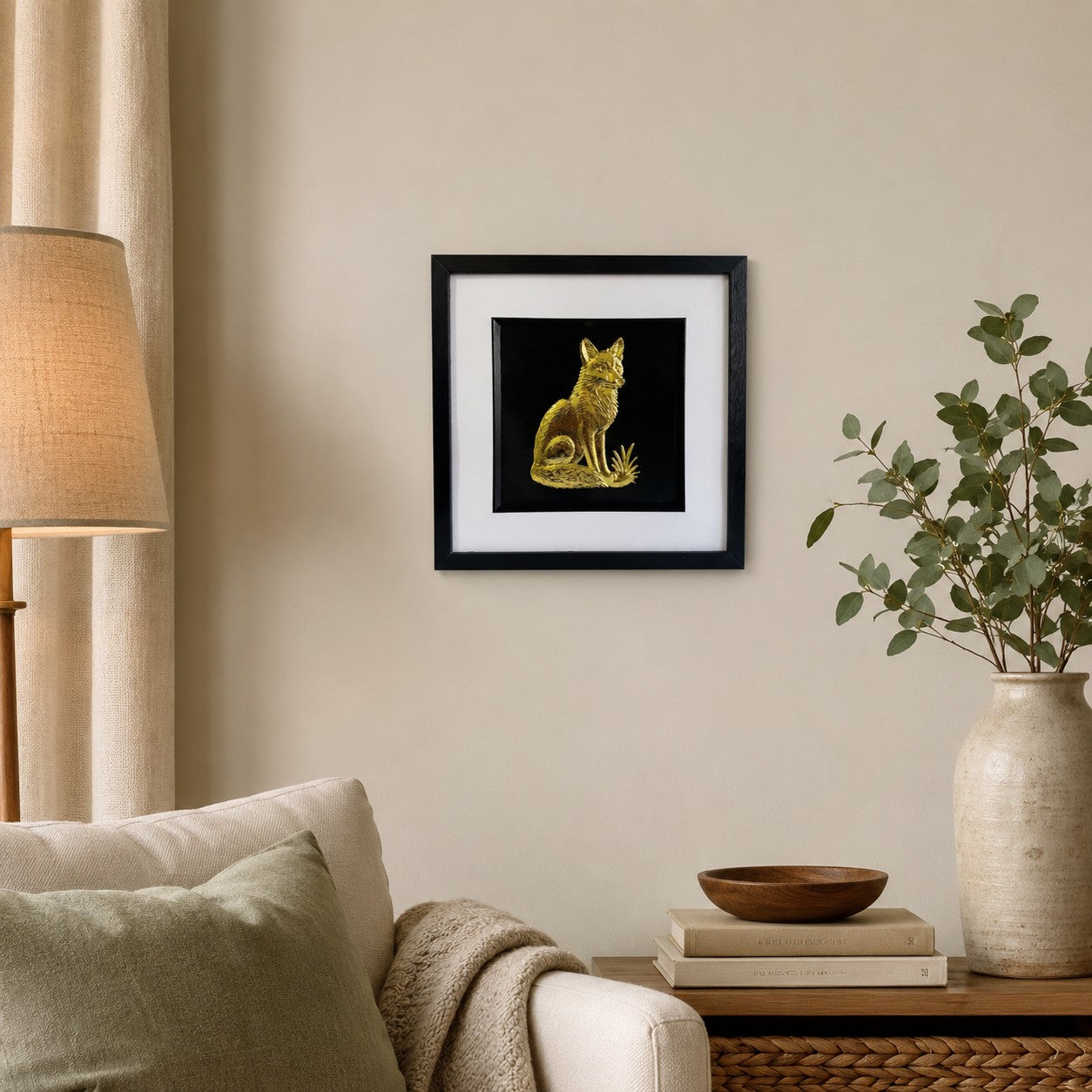 Gold fox framed wall art displayed on a warm neutral living room wall with sage green accents, natural wood decor and soft botanical styling.