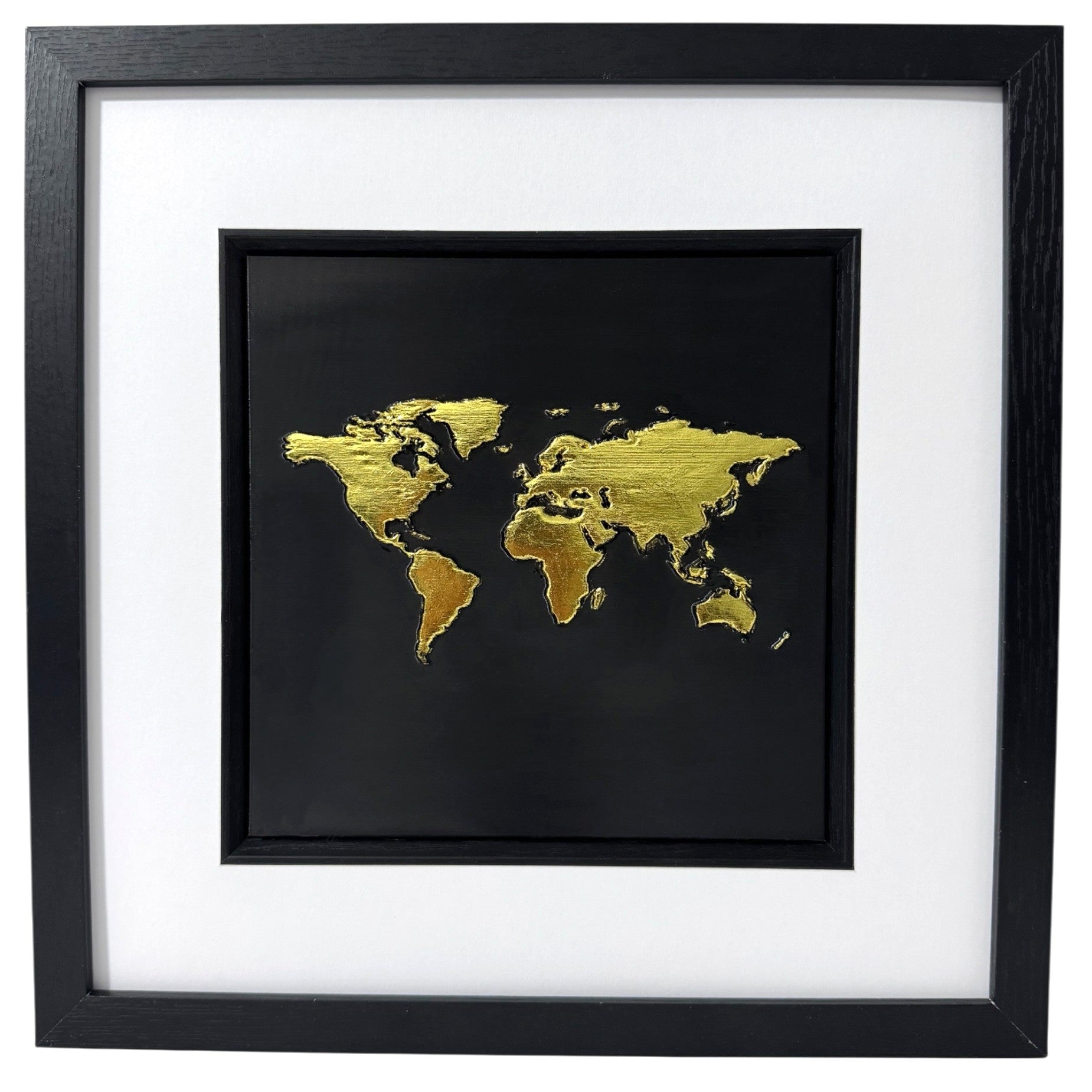 Gold metallic leaf World Map 3D wall art on black background. Hand-sculpted relief map in black wooden box frame with white mount.