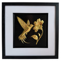 Front-facing gold leaf hummingbird and flower framed artwork on black background