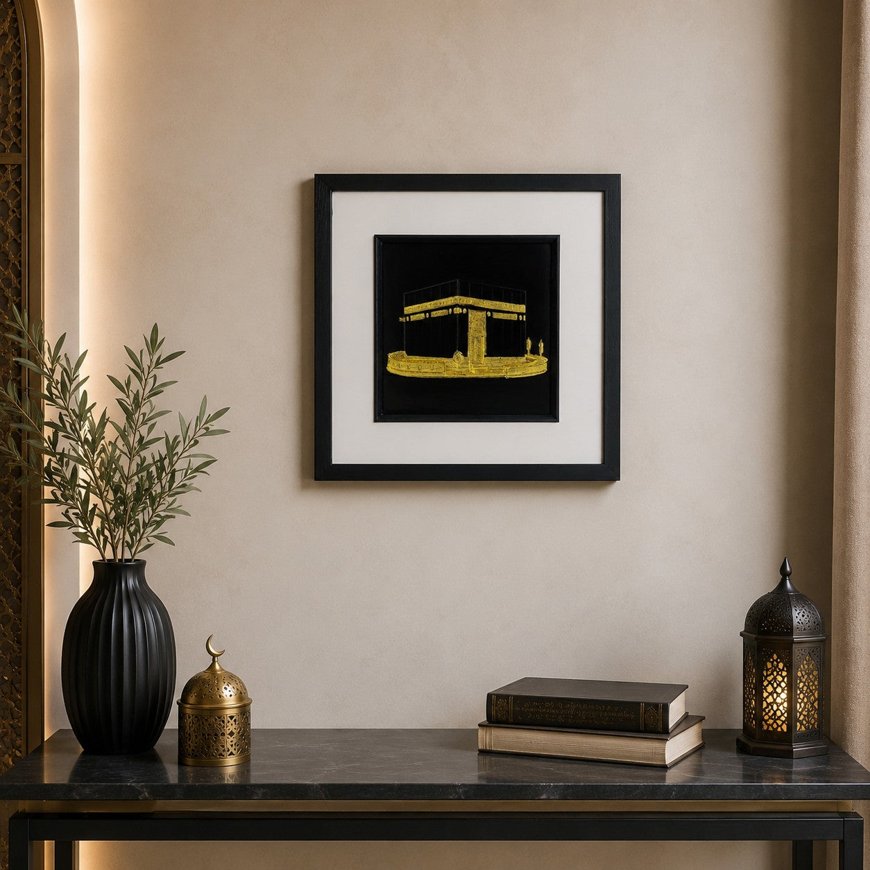 Gold Kaaba wall art displayed in a modern Islamic inspired interior, featuring a 33 cm square framed hand gilded gold leaf 3D relief design on a black background with elegant neutral decor.