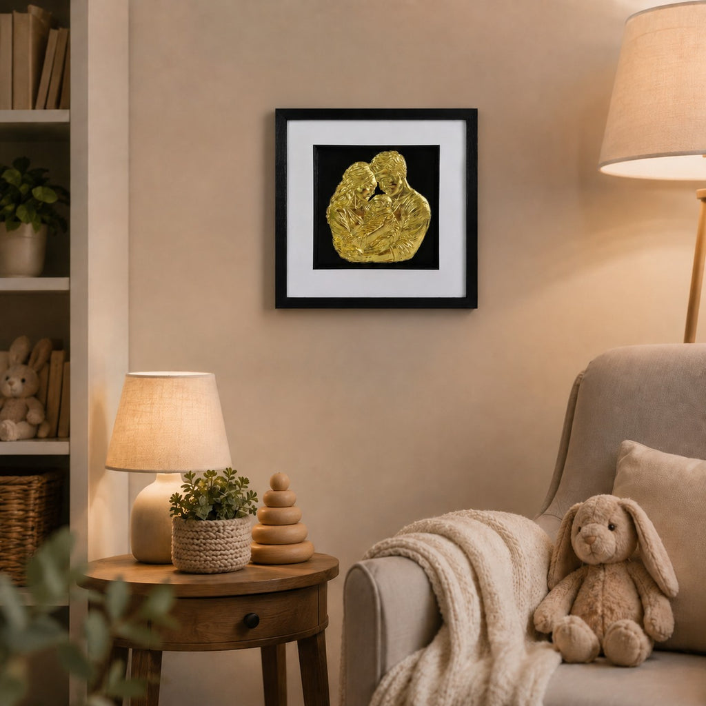 Gold finish framed family artwork styled in a soft nursery room with warm lamp light, shelving and bunny toy.