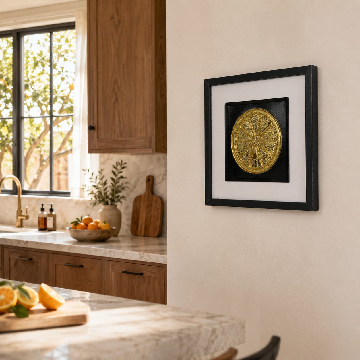 Gold orange slice wall decor styled in a warm kitchen with wood cabinetry, oranges and neutral styling