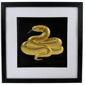 Gold framed snake relief artwork with coiled serpent, black centre, wide white mount and black square frame.