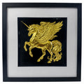 Framed winged unicorn wall art finished in realistic gold leaf, shown on a black background with a white mount and black frame for fantasy home decor.