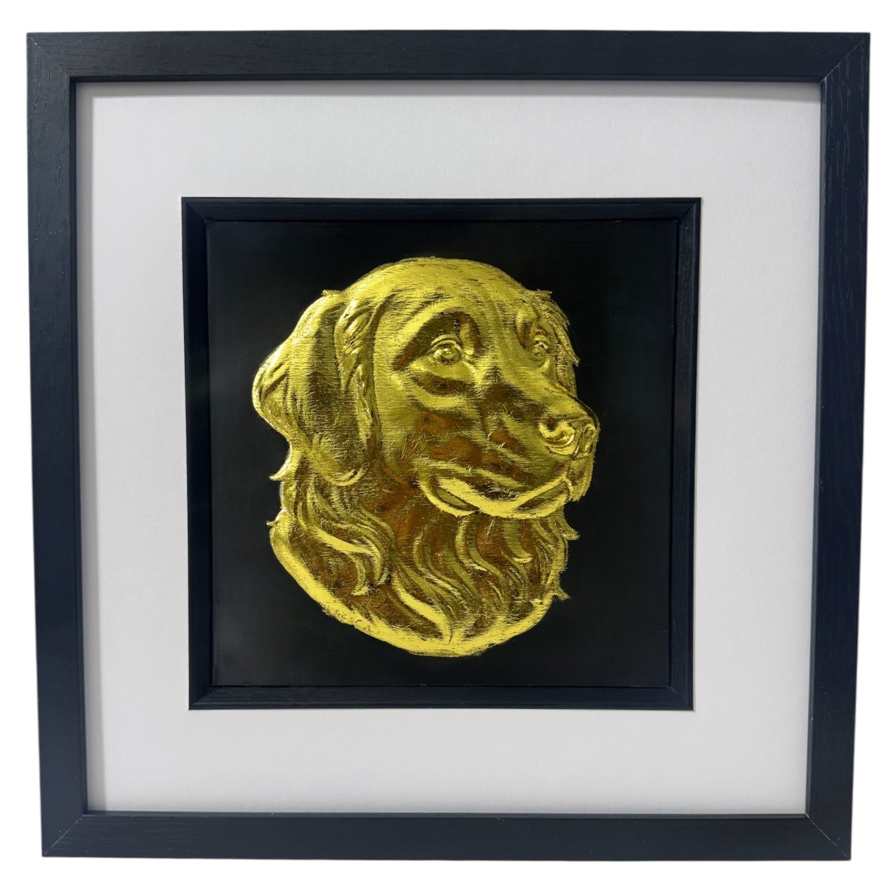 Golden Retriever framed wall art showing a sculpted dog portrait in gold leaf, set on a black background with white mount and black wooden frame