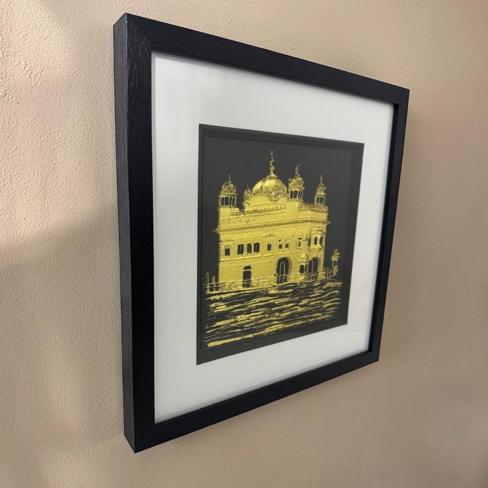 Framed Harmandir Sahib artwork with reflective water detail on wall