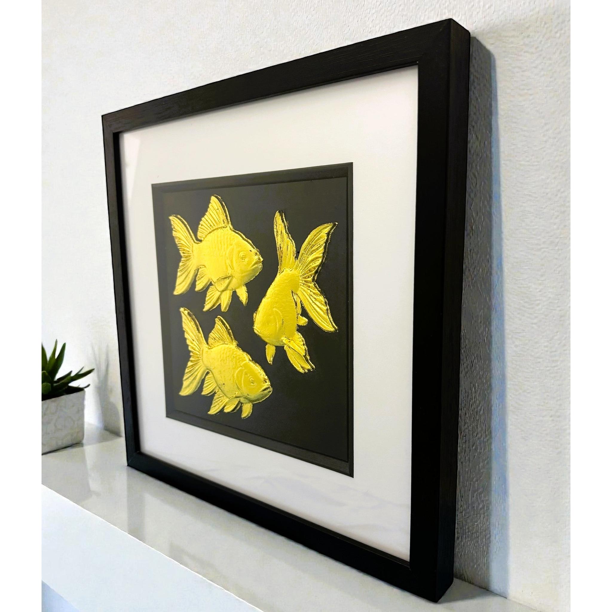 Angled shelf view of gold leaf goldfish framed wall art