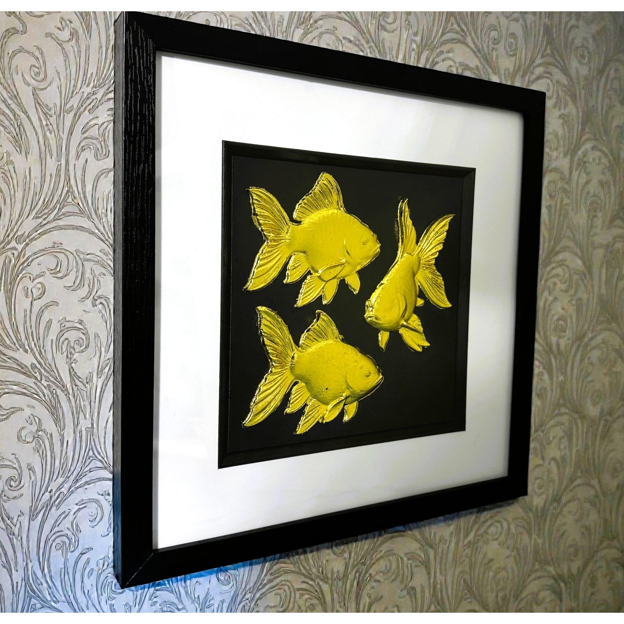 Angled wall-mounted view of goldfish wall art showing frame depth