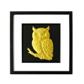 Front-facing gold leaf owl wall art with black background and white mount