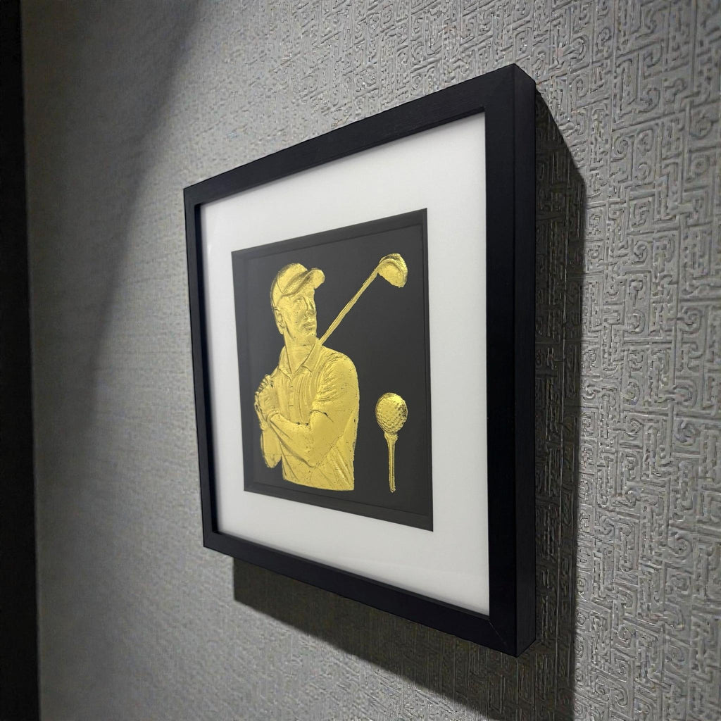 Close up of raised 3D golf ball detail on wall art.