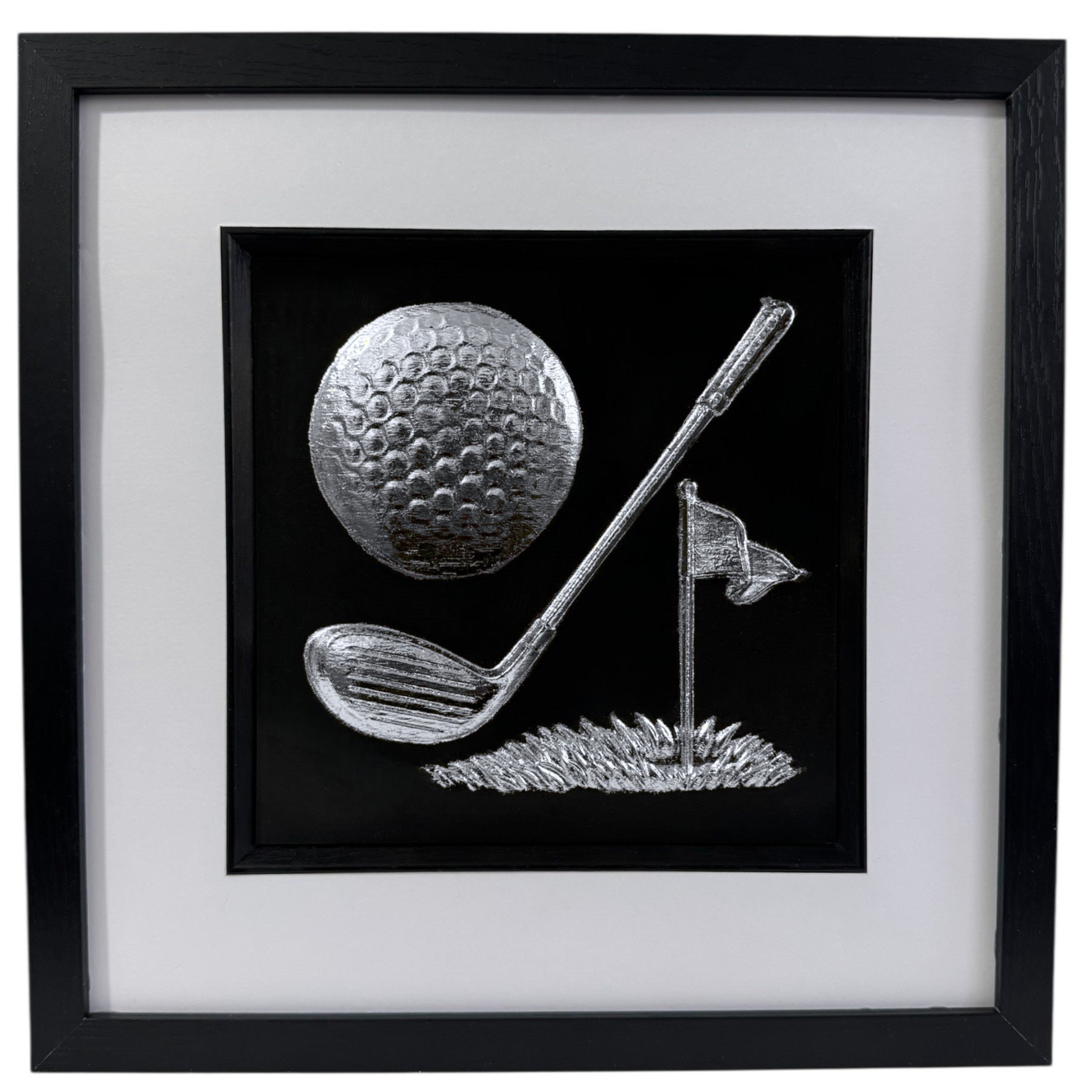 Silver 3D relief wall art of golf equipment on black background.