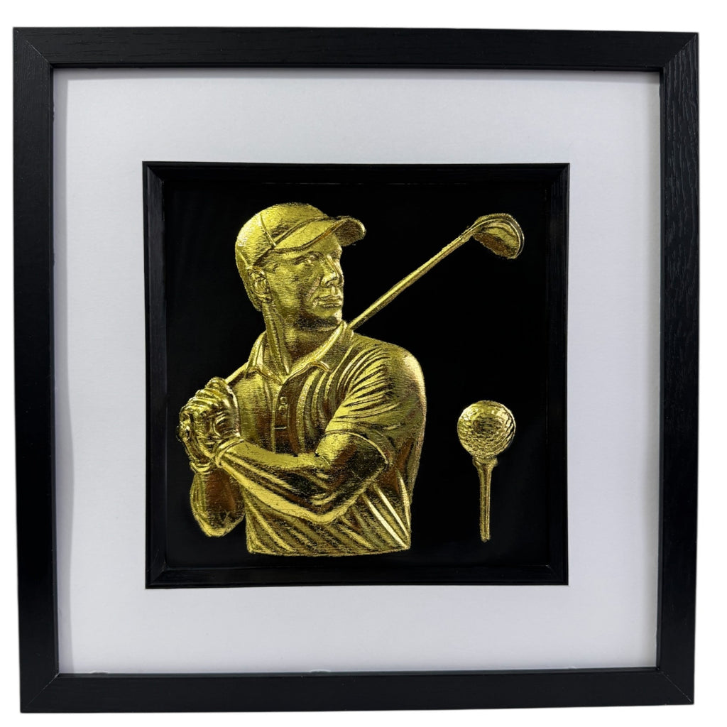 Gold 3D relief wall art of male golfer swinging and golf ball on tee.
