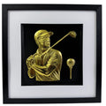 Gold 3D relief wall art of male golfer swinging and golf ball on tee.