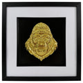 Gold framed gorilla head wall art with raised relief face, black backing, white mount and black frame.