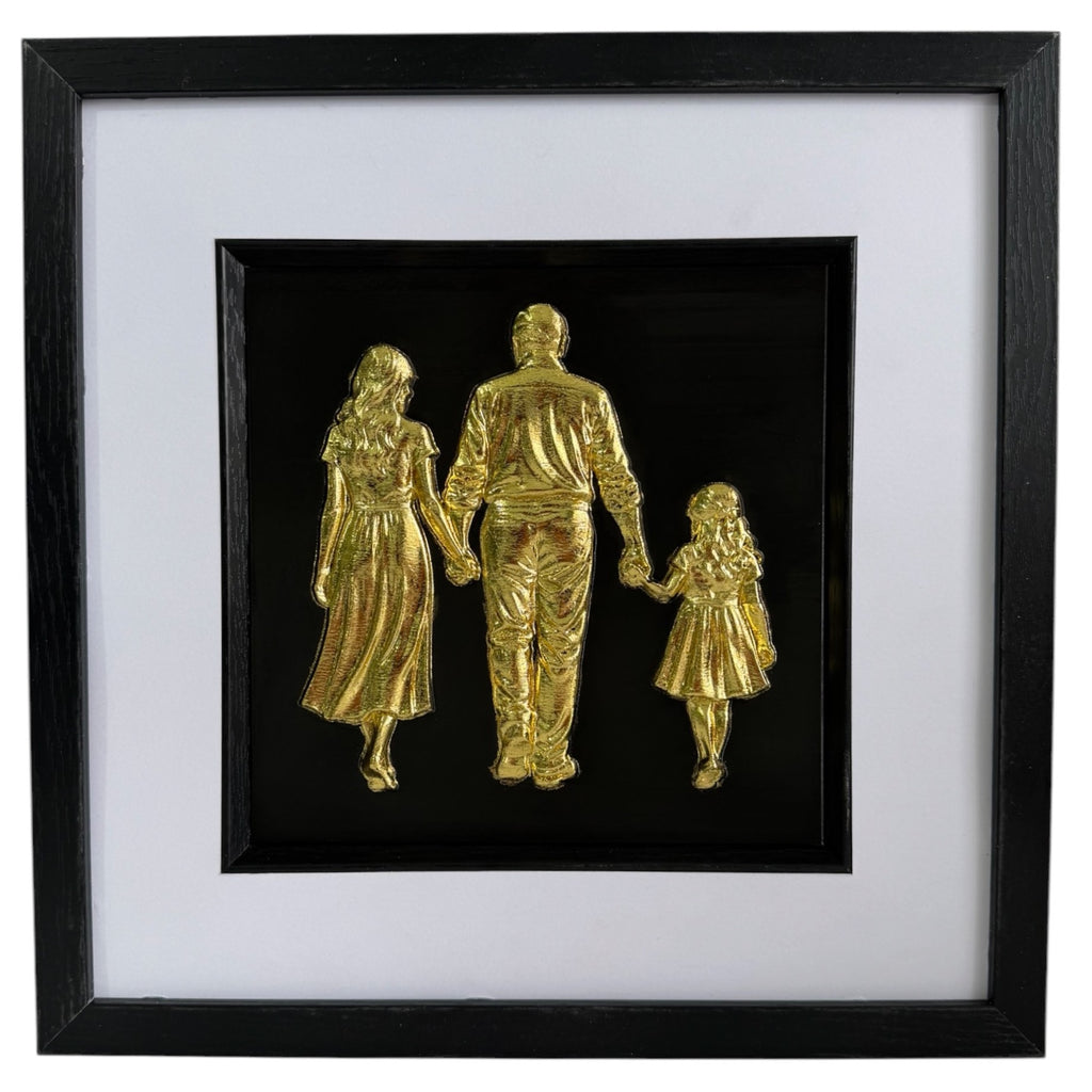 Straight-on Gold framed family relief artwork with black background, white mount and black box frame.