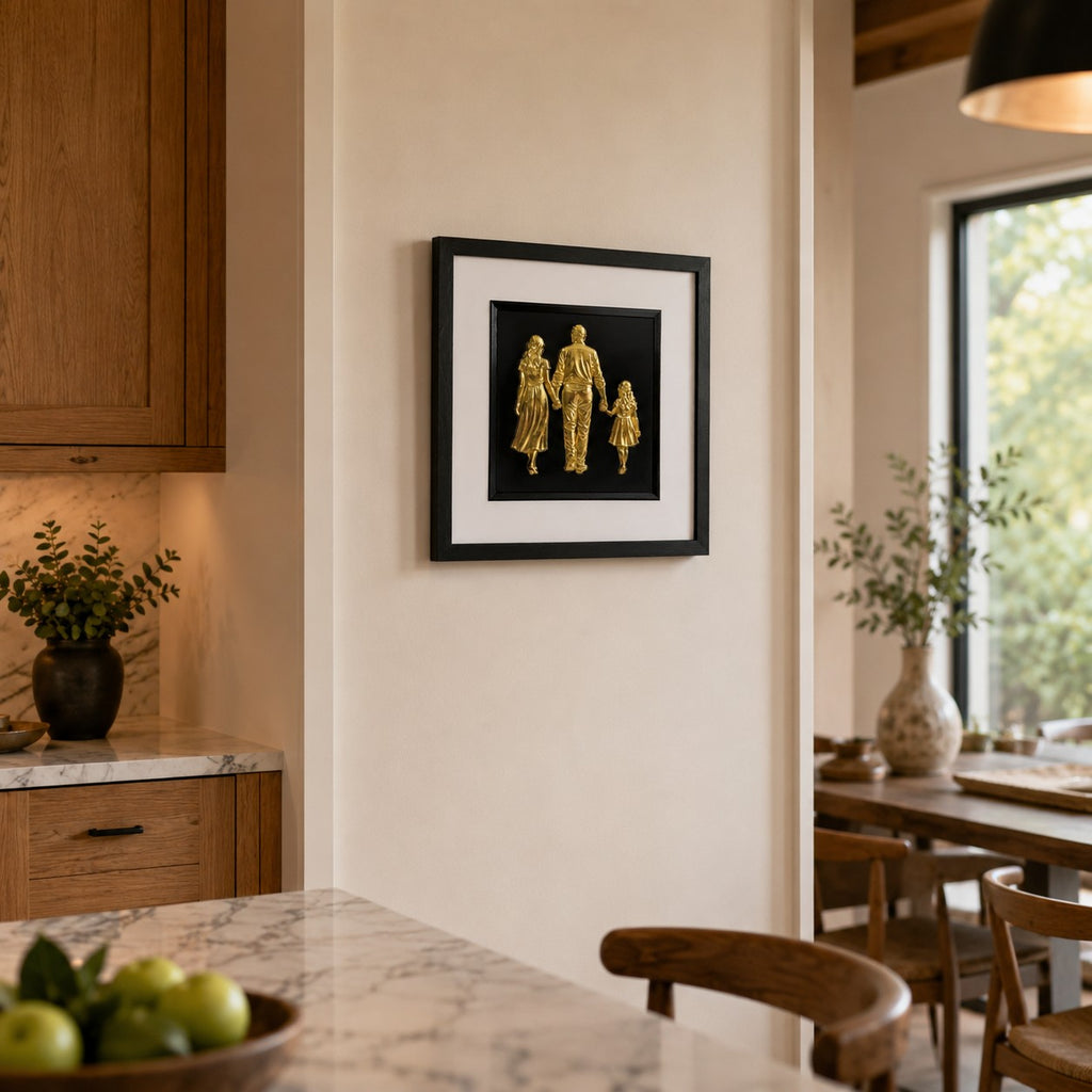 Framed Gold family artwork with white mount and black inner surround styled in warm kitchen and dining space.