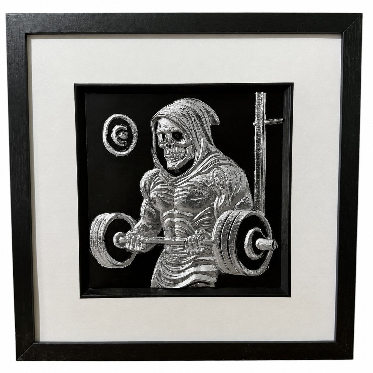 Framed grim reaper gym wall art, silver relief of a hooded skeleton curling a loaded barbell, on a black background in a black frame with white mount