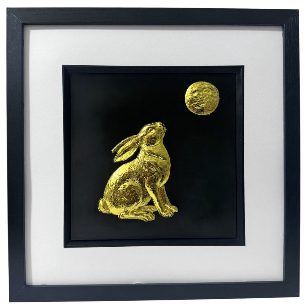 A luxury 3D relief sculpture of a Moon Gazing Hare, featuring a textured golden moon and detailed fur, framed in black.
