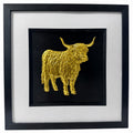 Gold Highland cow wall art framed in black with white mount