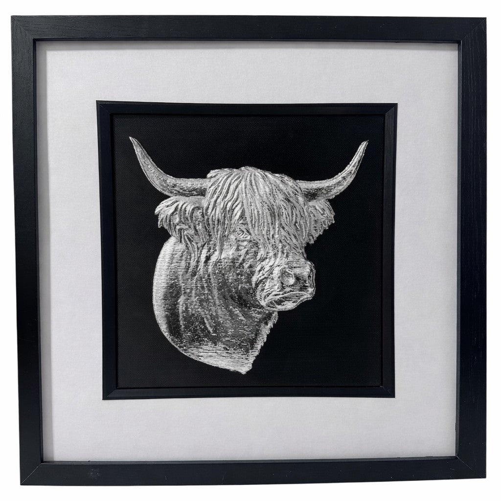 Front-facing silver leaf Highland cow head wall art with black background and white mount