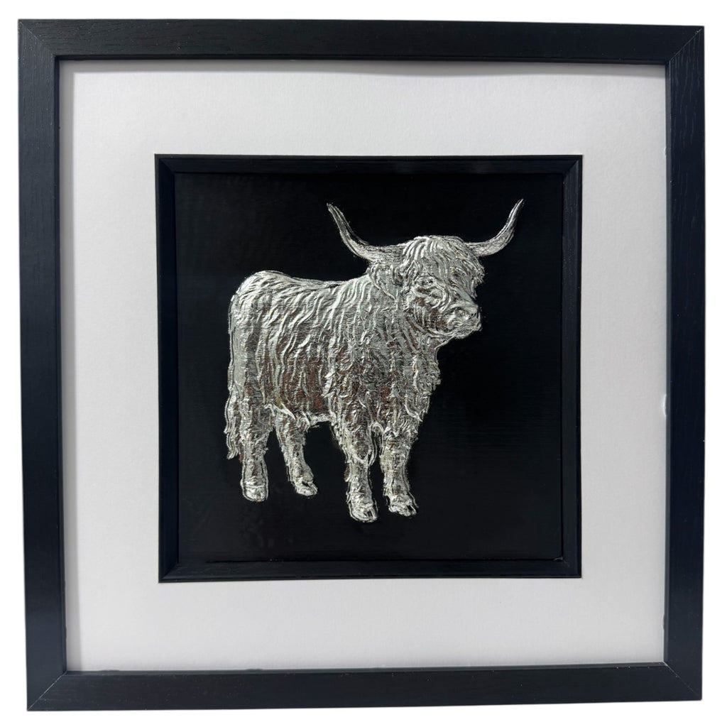 Silver full body Highland cow in raised relief, black background, black square box frame, wide white mount, black inner surround.