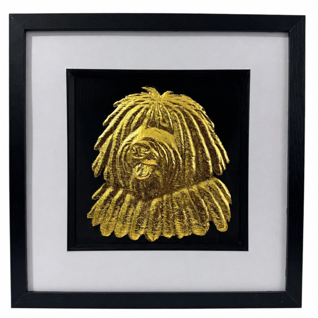 Hungarian Puli framed wall art showing a sculpted dog portrait with corded coat texture in gold leaf, set on a black background with white mount and black wooden frame
