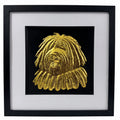 Hungarian Puli framed wall art showing a sculpted dog portrait with corded coat texture in gold leaf, set on a black background with white mount and black wooden frame
