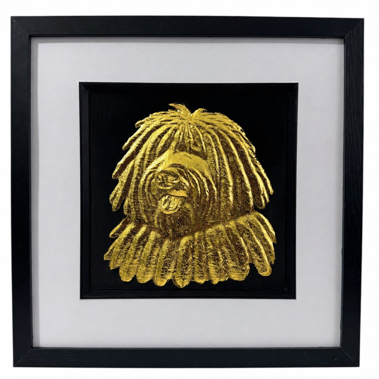 Hungarian Puli framed wall art showing a sculpted dog portrait with corded coat texture in gold leaf, set on a black background with white mount and black wooden frame
