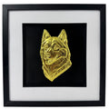 Siberian Husky snow dog framed wall art showing a sculpted dog portrait in gold leaf, set on a black background with white mount and black wooden frame
