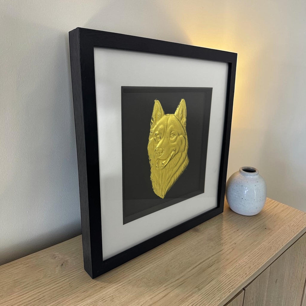husky snow dog 3d  wall art gold frame on a light wooden surface next to a ceramic vase 