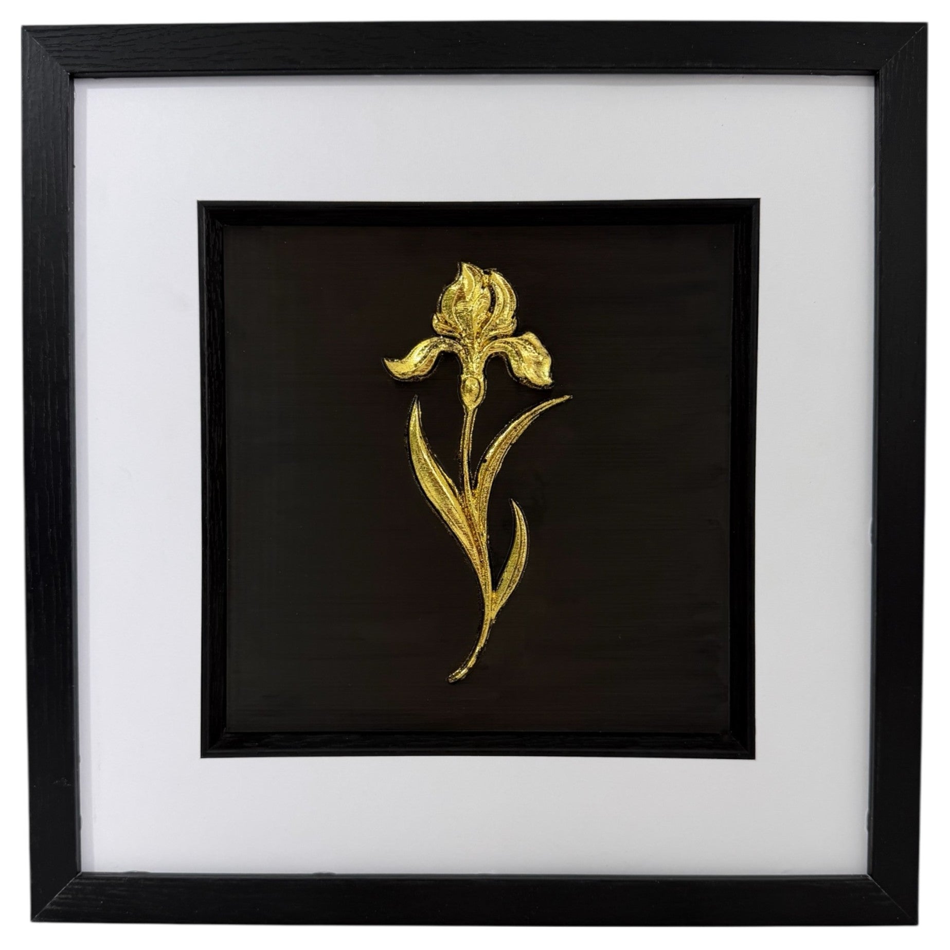Gold iris raised relief in a black frame with white mount and black inner surround on a white background.