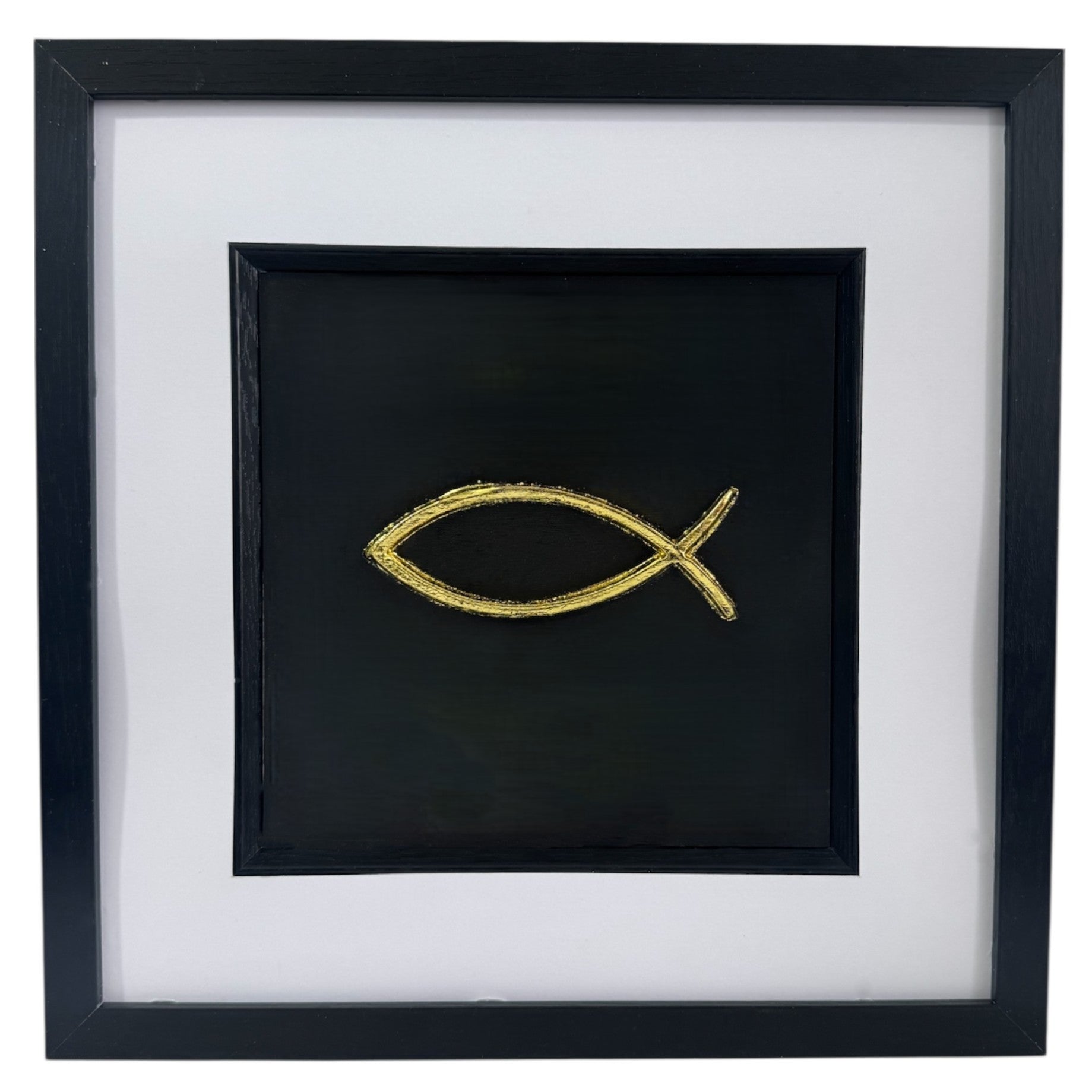Framed Ichthys fish wall art in gold leaf with black frame and white mount