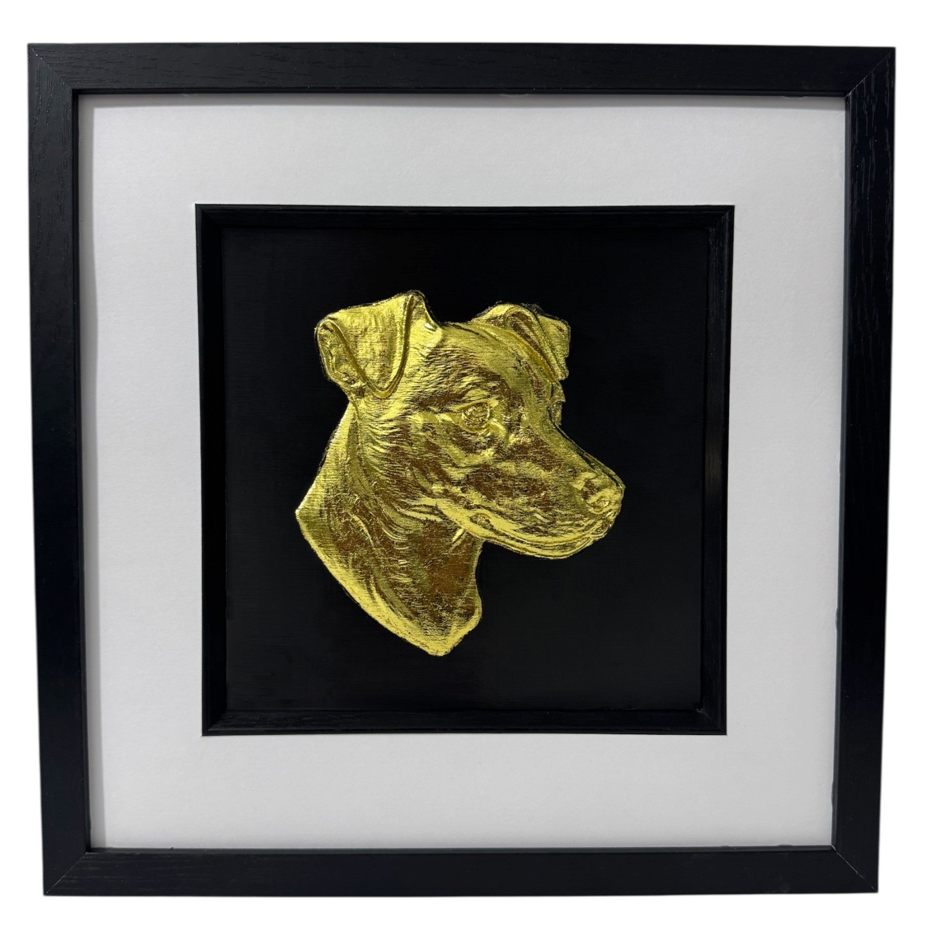 Jack Russell Terrier 3d wall art framed showing a sculpted dog portrait in gold leaf, set on a black background with white mount and black wooden frame

