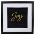 Gold framed Joy word artwork with raised script lettering, black centre panel, white mount and black frame.