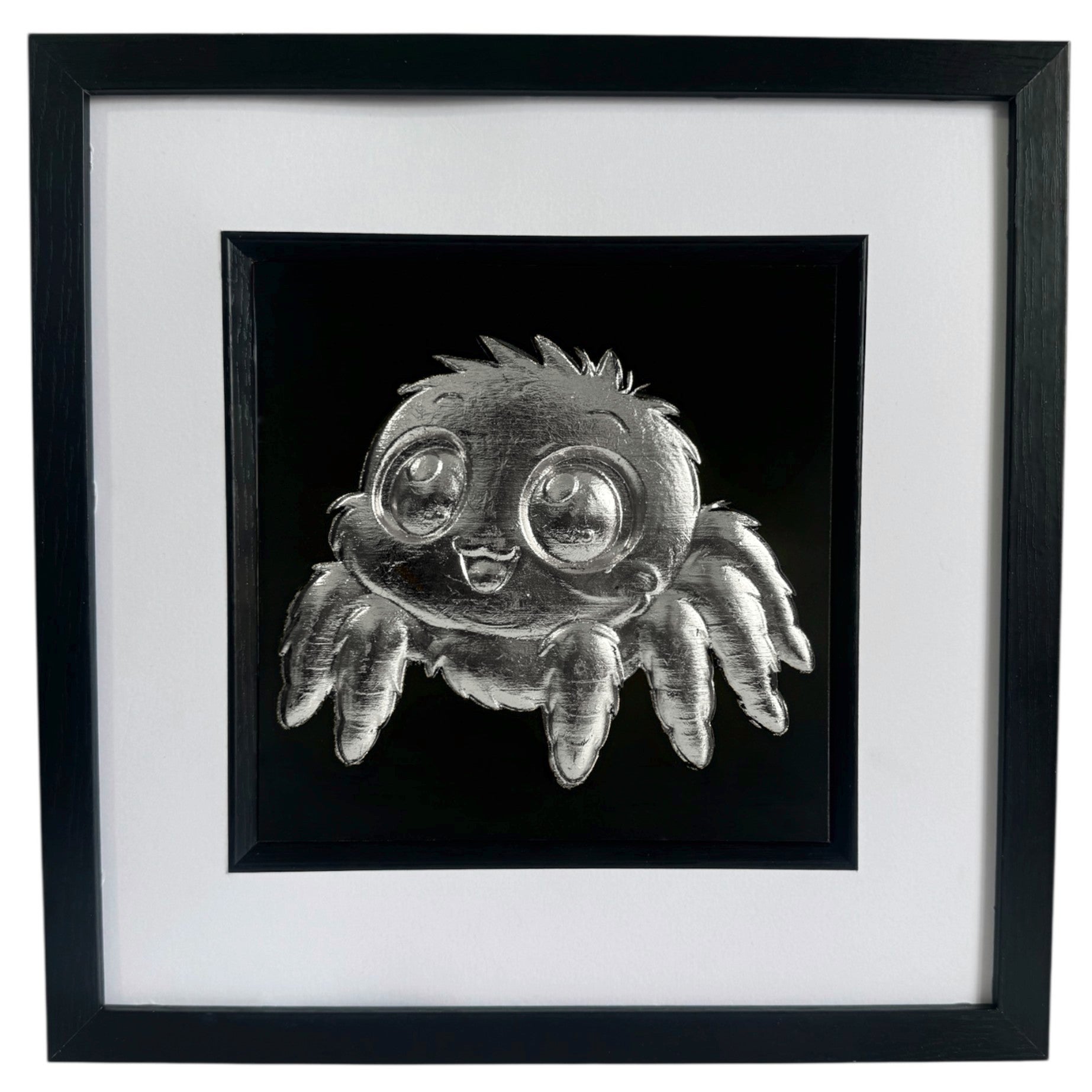 Front view of Silver jumping spider wall art in a black box frame with white mount and black background