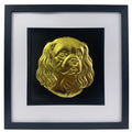 Cavalier King Charles Spaniel framed wall art showing a sculpted dog portrait with long ears in gold leaf, set on a black background with white mount and black wooden frame
