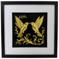 Framed 3D wall art of kissing hummingbirds featuring a hand-gilded gold leaf finish on a black background. Modern romantic nature decor by JP Designs.
