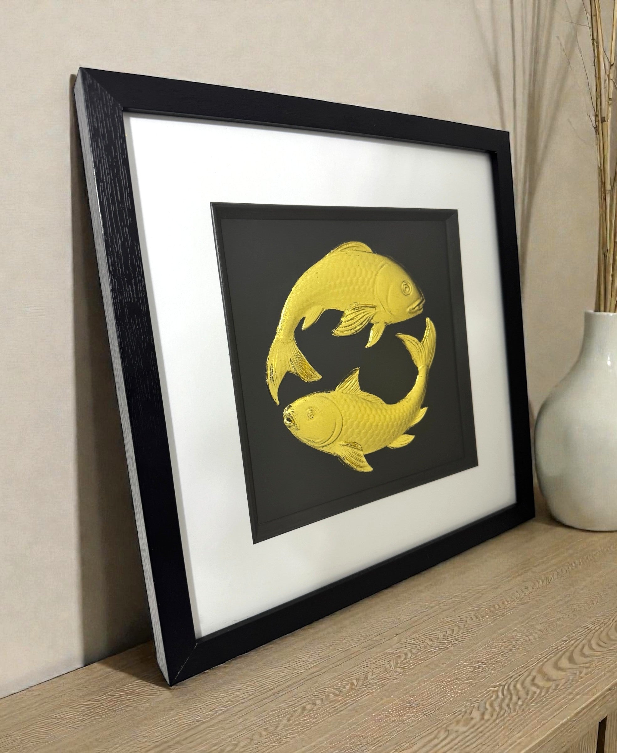 A frontal view of the framed Koi Carp sculpture, highlighting the circular composition representing harmony and balance.