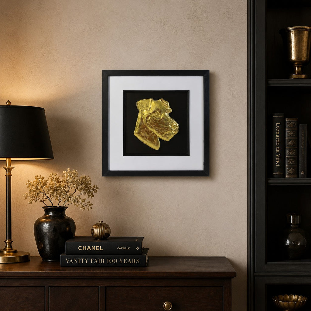 Lakeland Terrier gold leaf framed wall art displayed on a warm neutral wall with dark wood furniture, black accents and luxury gold decor.