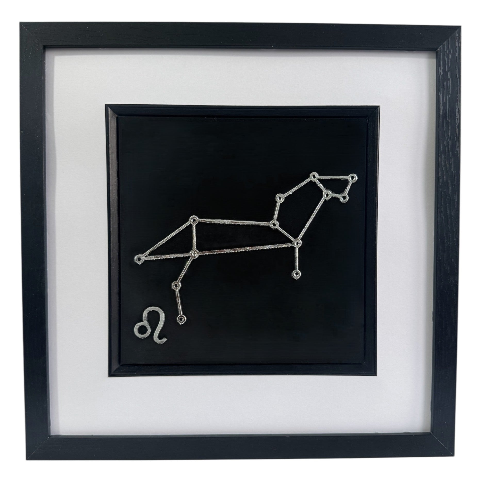 Silver Leo constellation wall art on black background with white mount