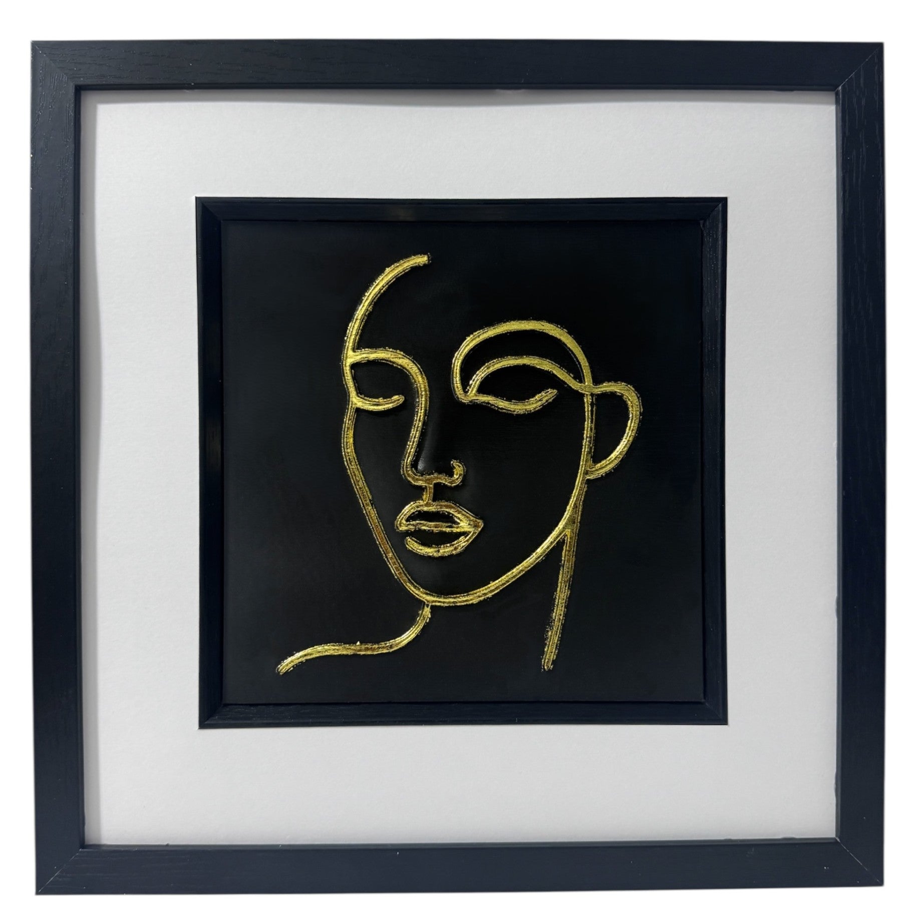 Minimalist female line art wall art finished in gold leaf in black frame