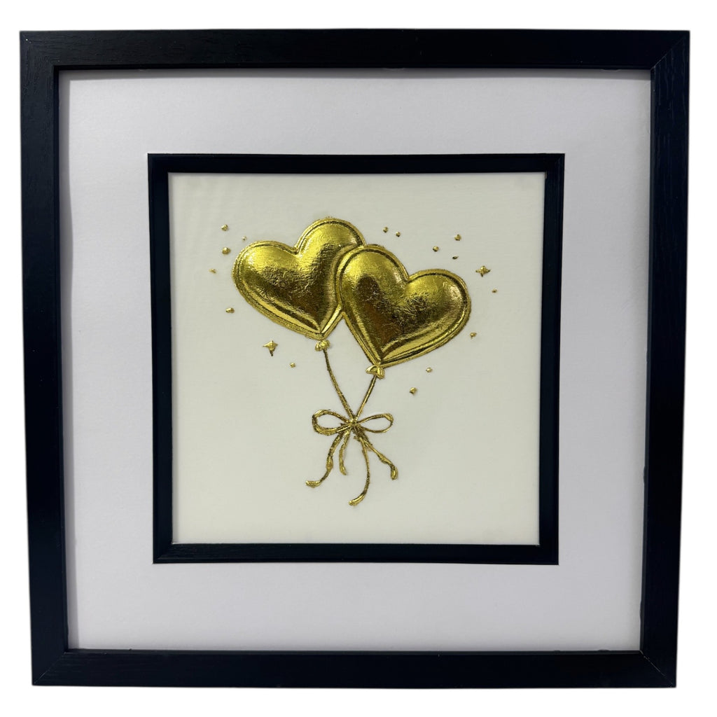 Front-facing gold leaf heart balloons wall art on a light  Ivory background with tied ribbon detail