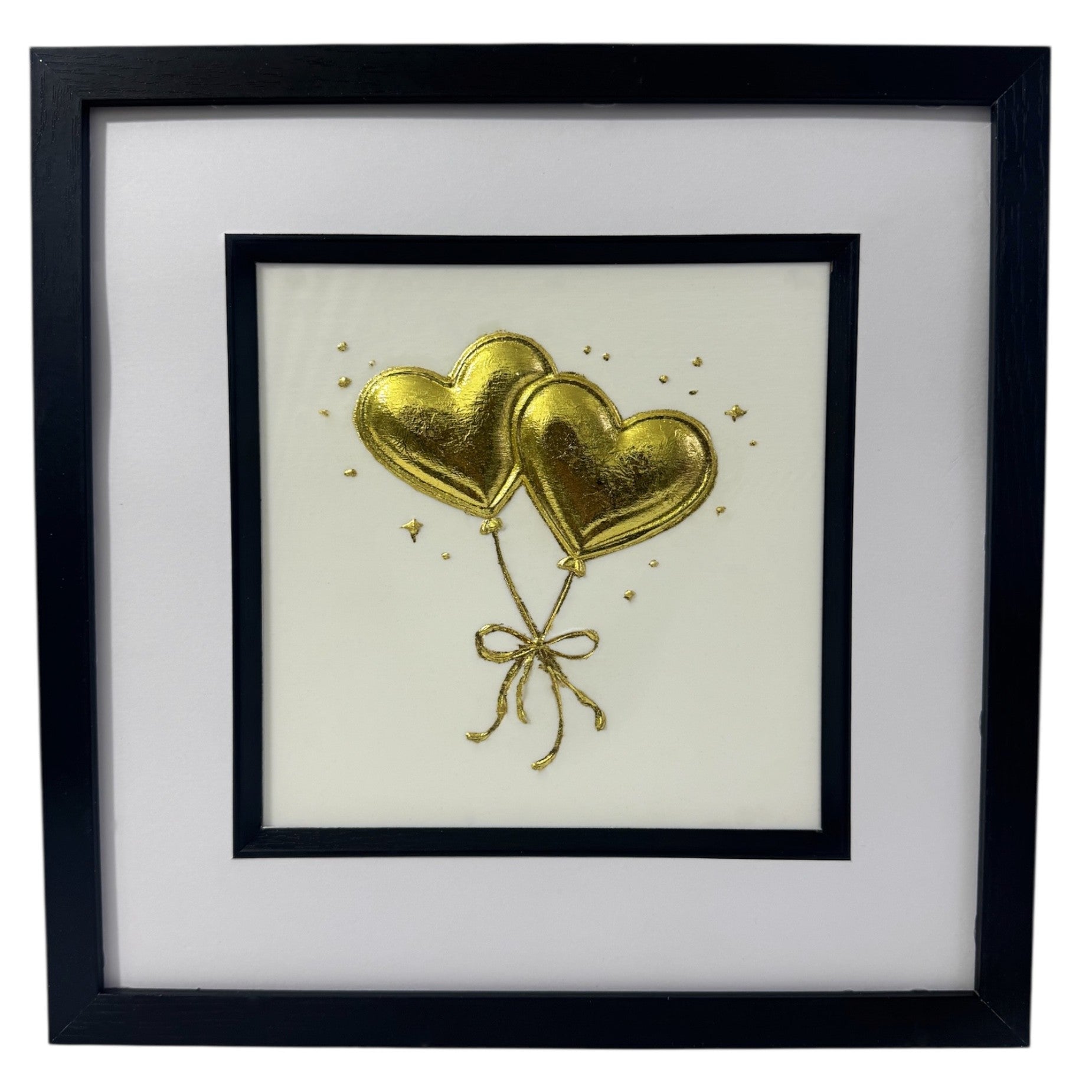 Front-facing gold leaf heart balloons wall art on a light  Ivory background with tied ribbon detail