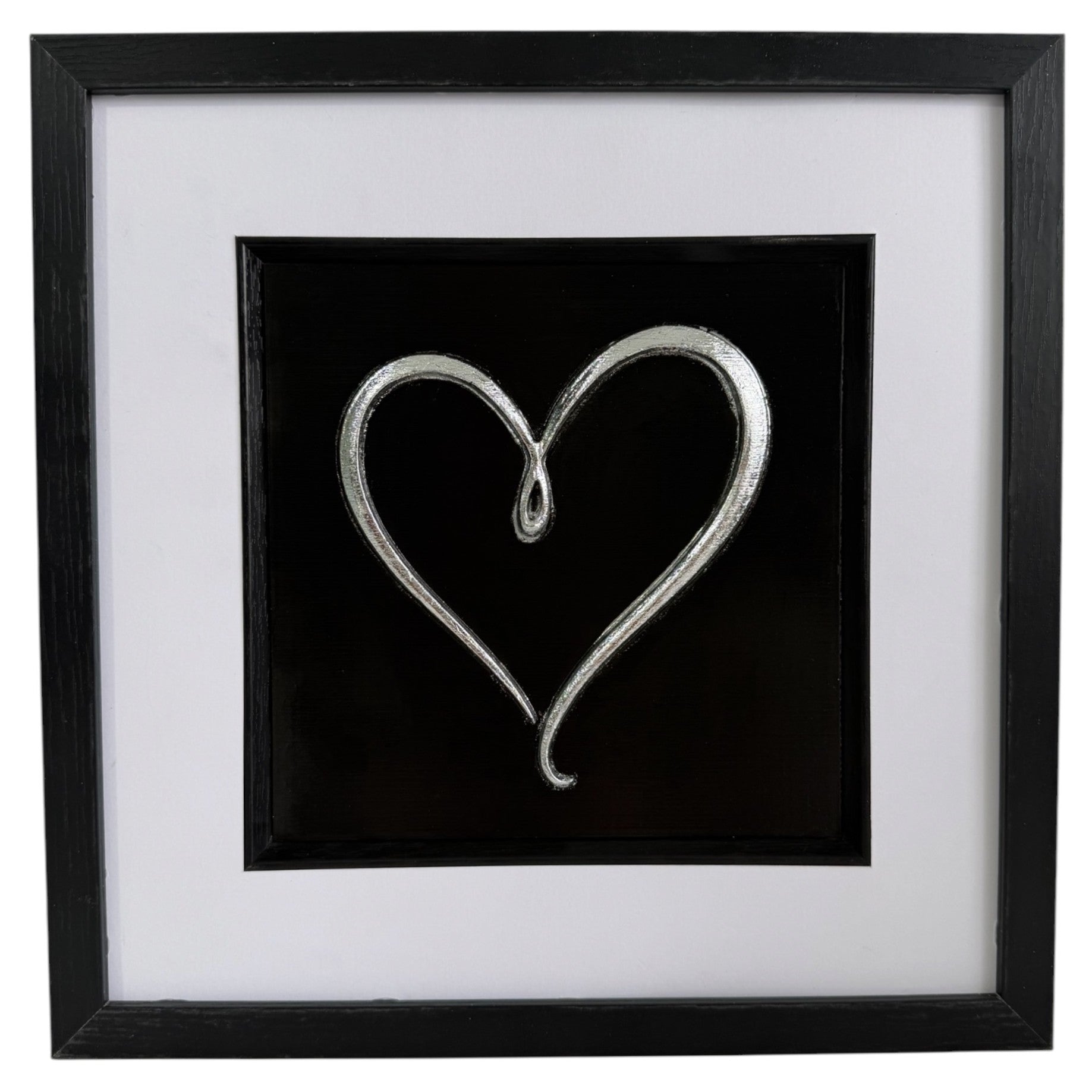 Straight-on Silver single-line heart relief artwork with black centre panel, white mount and black frame.