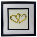 Front-facing gold leaf joined hearts framed wall art with white mount and Ivory background