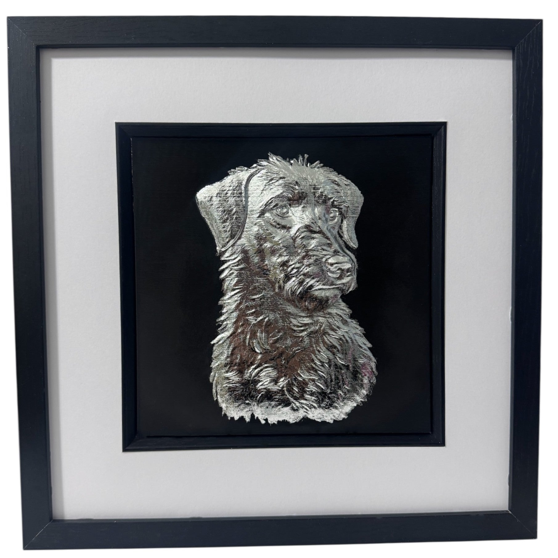 Lurcher framed wall art in silver leaf shown front on with black wooden frame white mount and black background