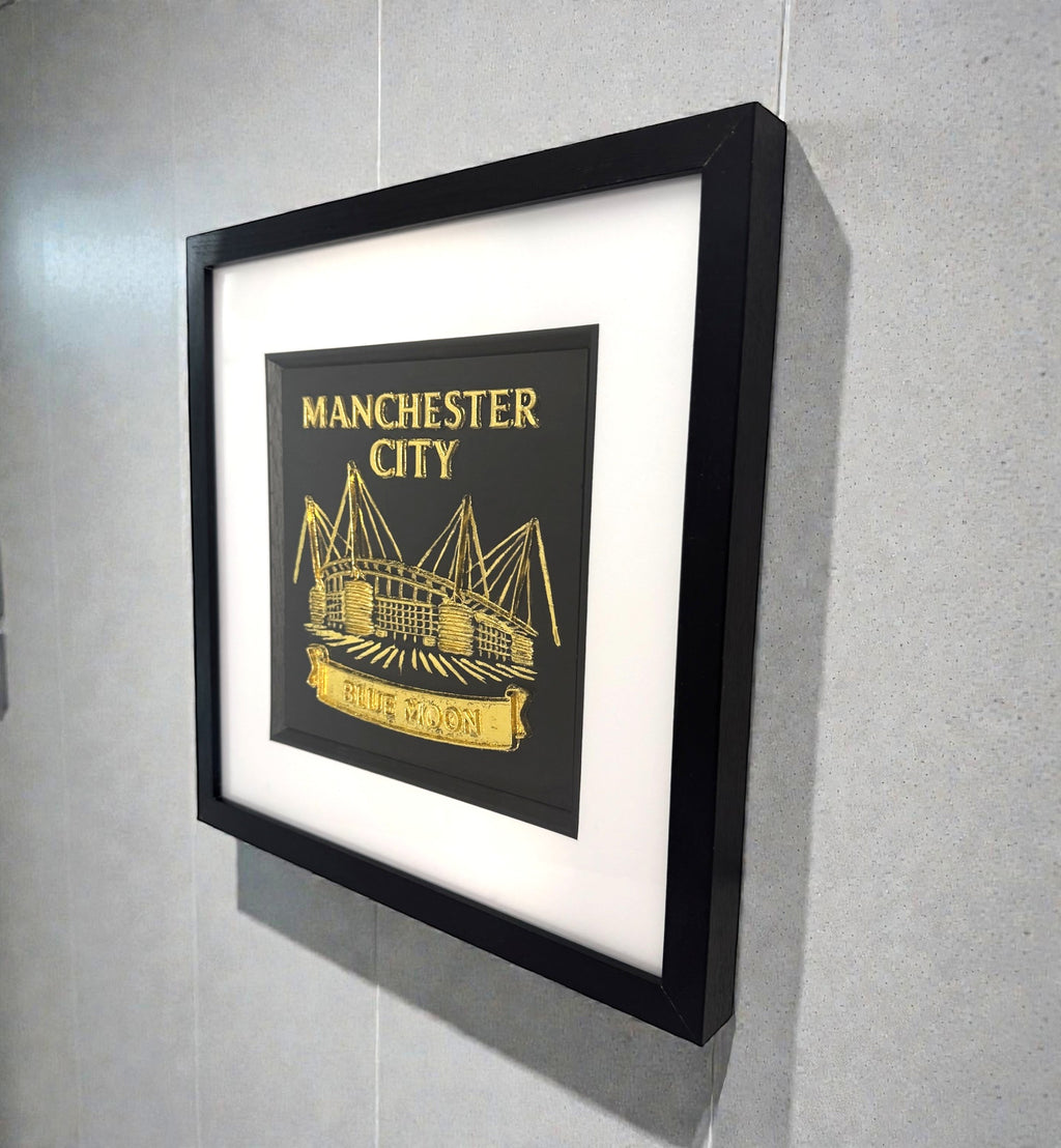 Close up of raised 3D Blue Moon banner on Manchester City wall art.