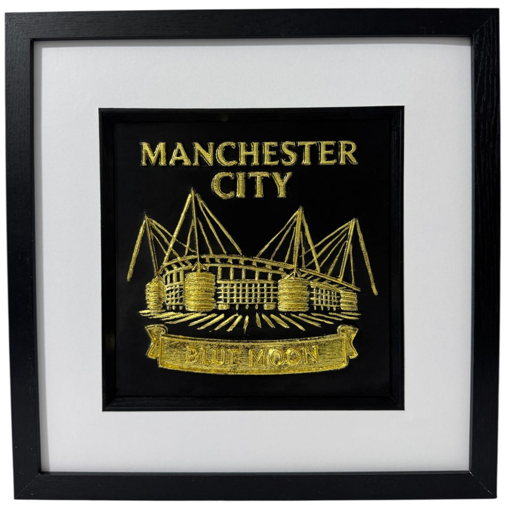 Gold 3D relief wall art of Manchester City Etihad Stadium featuring Blue Moon banner.