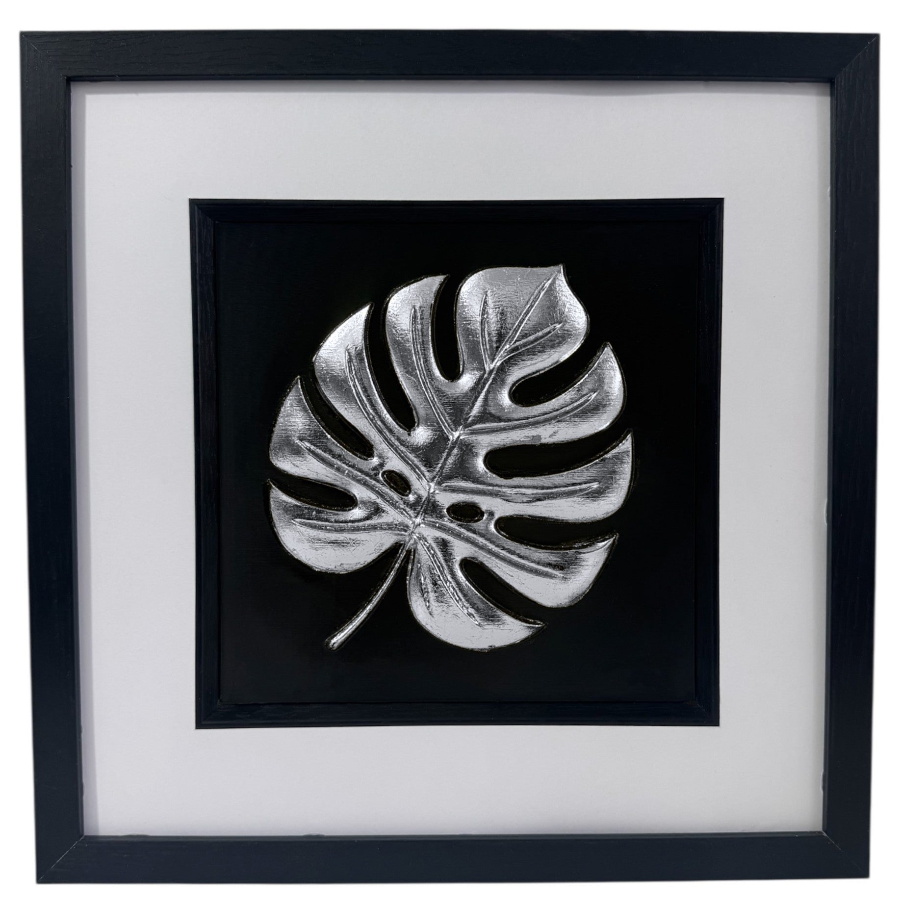 Silver monstera leaf 3D relief in black box frame with white mount, product photo